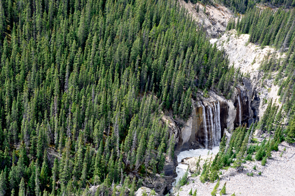 A waterfall and the river, far below